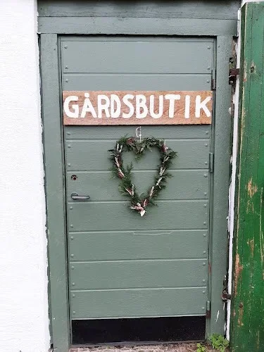 Den gröna dörren till gårdsbutiken